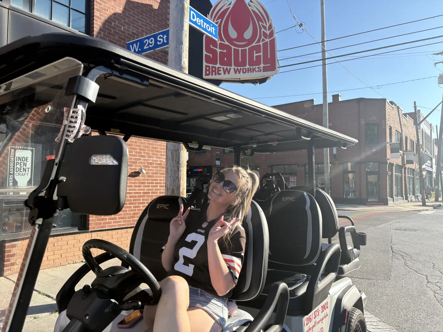 The Golf Cart Girl-CLE Browns game day golf cart outside Saucy Brew Works in Cleveland