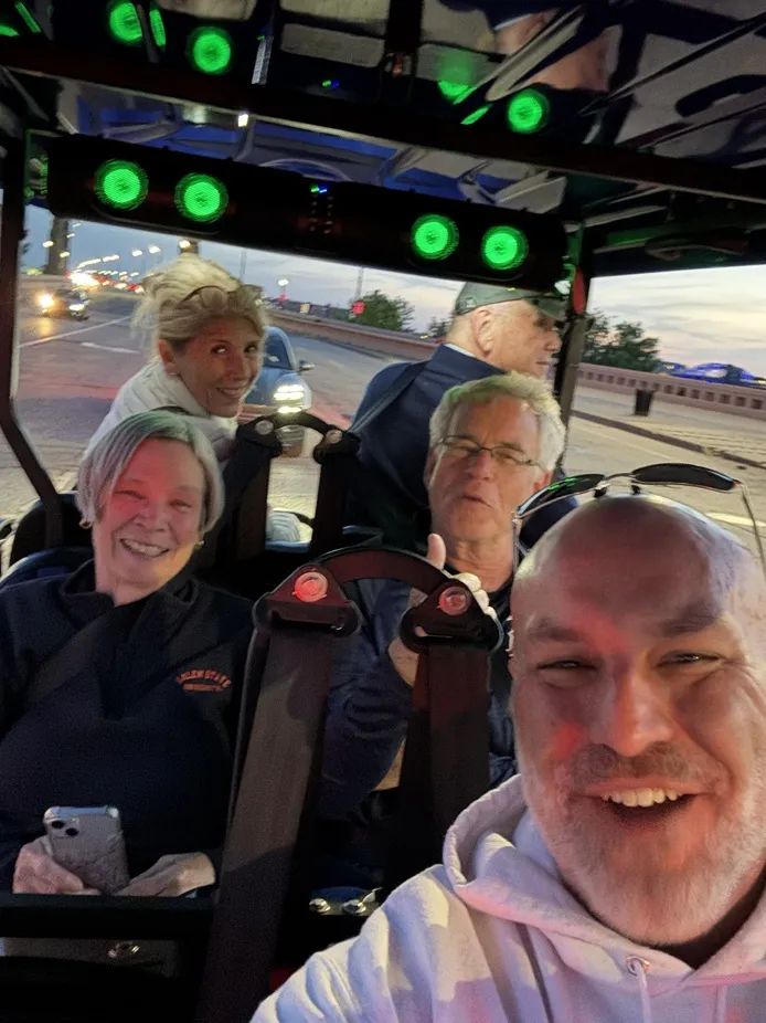 Chris driving riders through Cleveland with The Golf Cart Girl-CLE.
