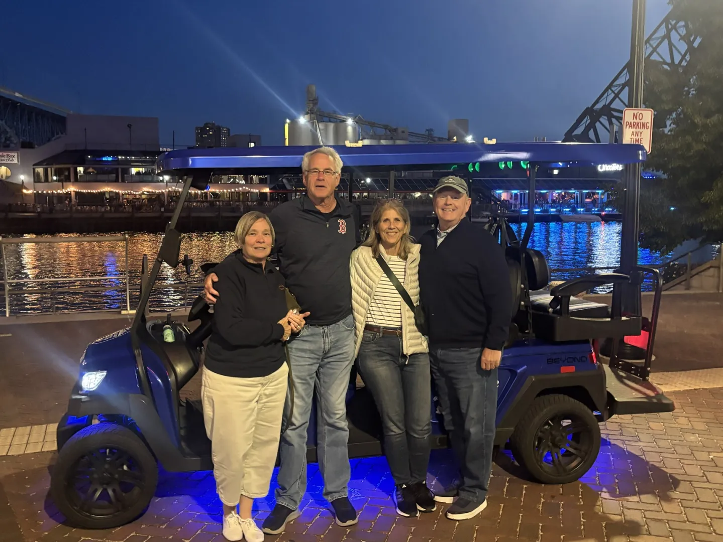 A double date group posing near the river during a Cleveland cart ride.