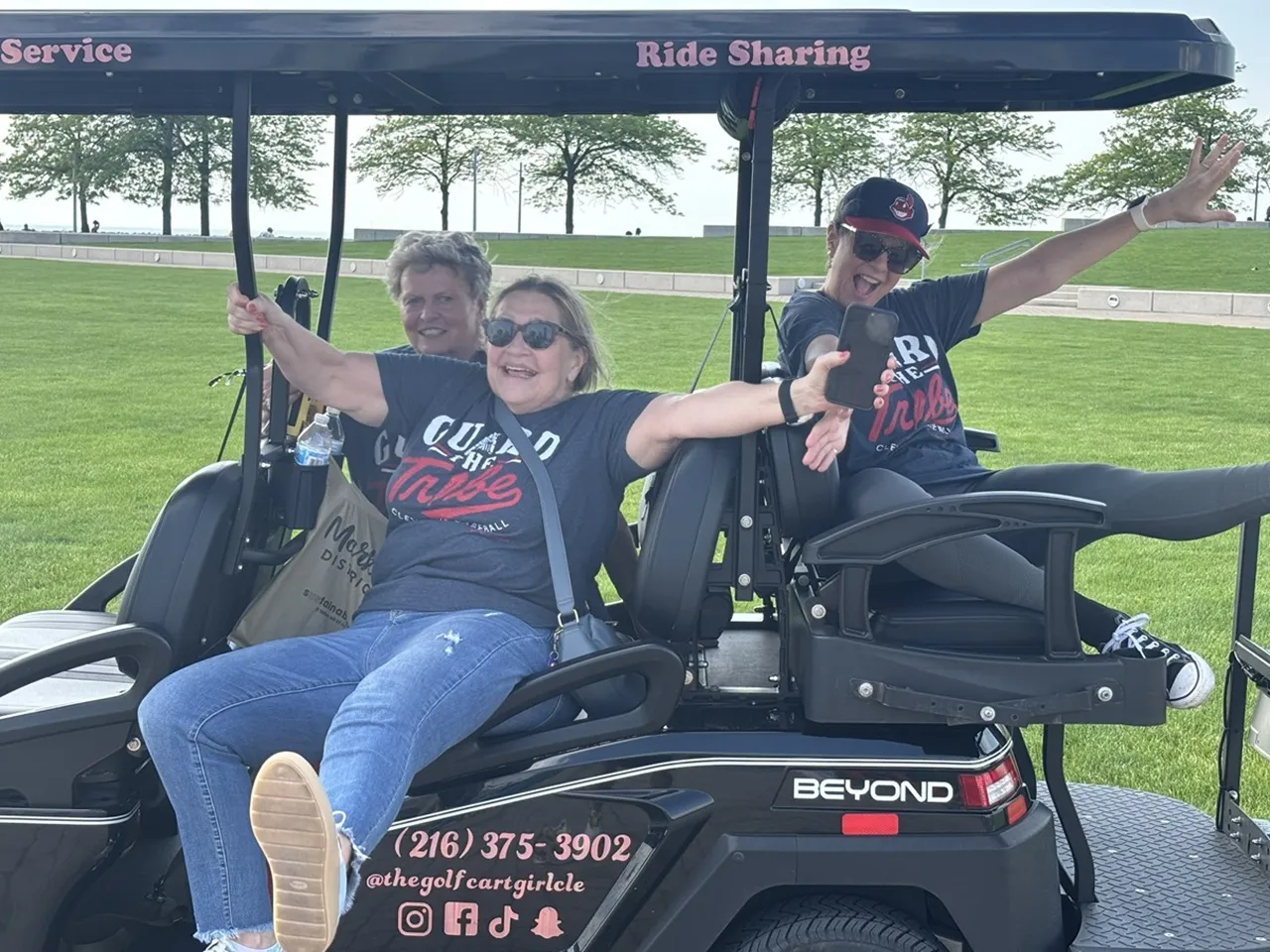 Local riders posing with The Golf Cart Girl-CLE.