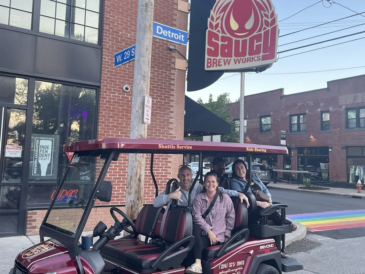 Visitors enjoying a Cleveland golf cart ride with The Golf Cart Girl-CLE.