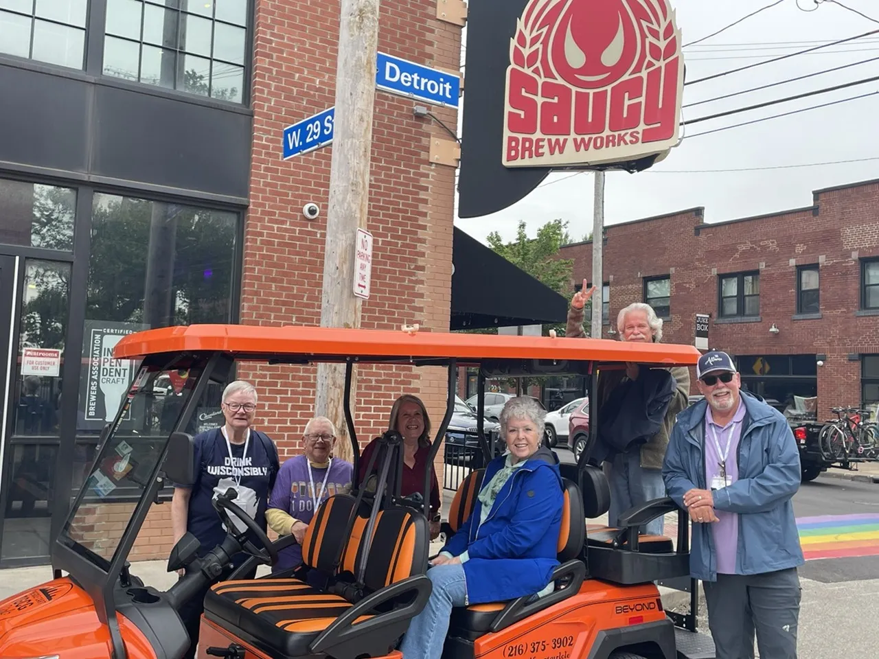 A group enjoying a Cleveland cart ride near Saucy Brew Works.