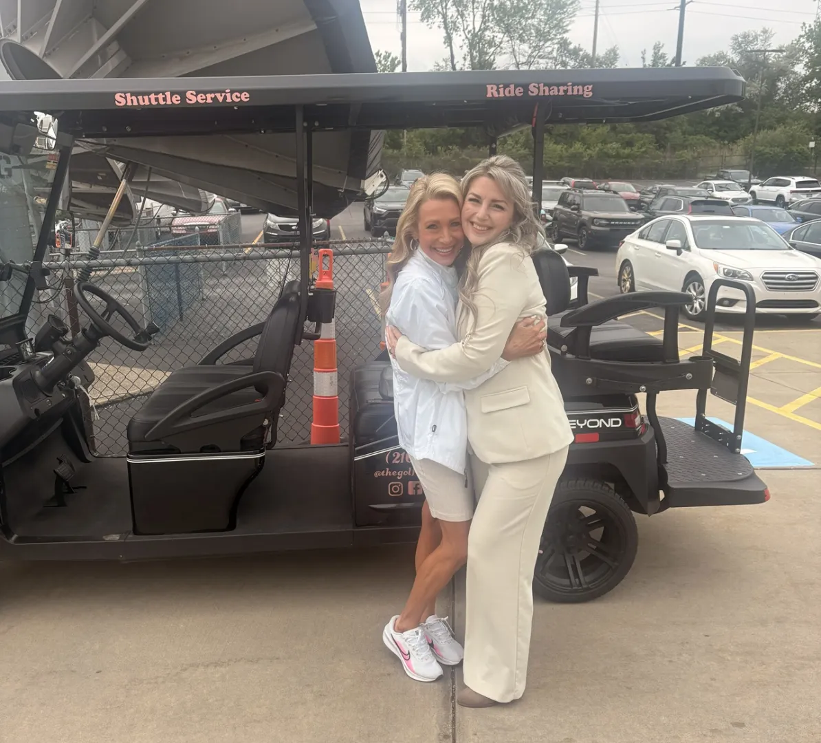 A rider posing with The Golf Cart Girl-CLE during a Cleveland experience.