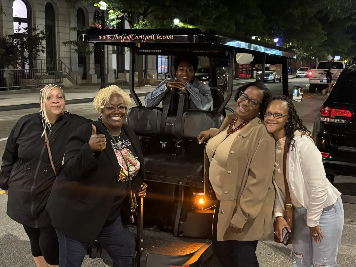 Friends enjoying a Cleveland wine and cocktail cart experience.